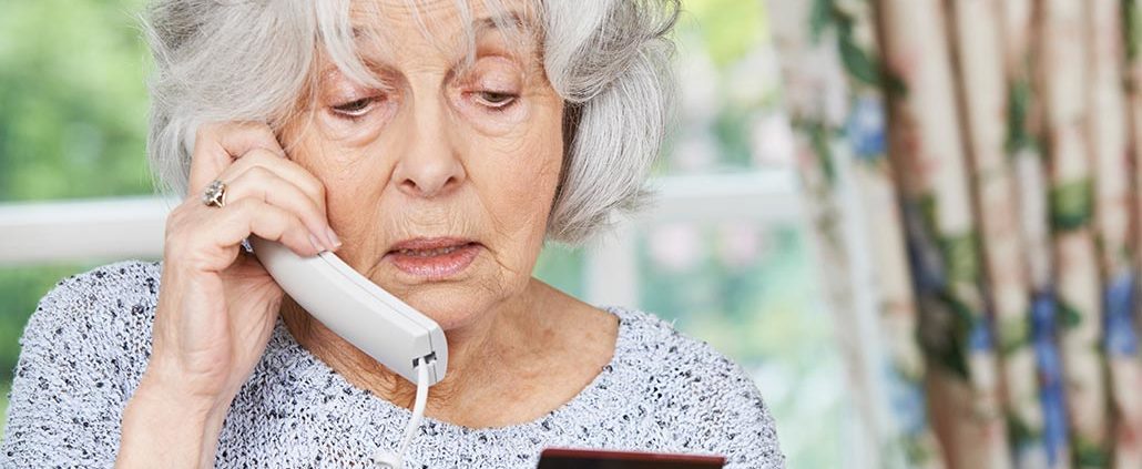 An Image of a Retired Women On the Phone While Holding a Credit Card Put On By Secure Money Advisors In Pittsburgh