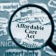 An Image of a Magnifying Glass That Focuses on Affordable Care Act Put On By Secure Money Advisors In Pittsburgh