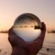 An Image of a Glass Ball With a Reflection of a Beach Put On By Secure Money Advisors In Pittsburgh