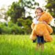 An Image of a Little Girl Holding a Stuffed Bear Put On By Secure Money Advisors In Pittsburgh