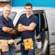 An Image of Two Working Men Standing in Front of a Company Van Put On By Secure Money Advisors In Pittsburgh