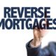 An Image of a Business Man Pointing at a Reverse Mortgages Sign Put On By Secure Money Advisors In Pittsburgh