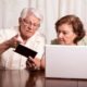 An Image Of A Retired Couple Looking At Their Laptop Put On By Secure Money Advisors In Pittsburgh