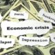 An Image Of Economic Crisis Words Placed On A Pile Of One Hundred Dollar Bills Put On By Secure Money Advisors In Pittsburgh