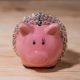 An Image Of A Pink Piggy Bank Wrapped In A Chain To Represent Why You Shouldn't Take A 401(k) Loan Put On By Secure Money Advisors In Pittsburgh