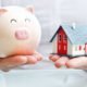An Image Of A Person Holding A Piggy Bank In One Hand And A Model House In Another For Strategies For Carrying A Mortgage Into Retirement Put On By Secure Money Advisors In Pittsburgh