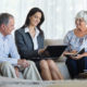 An Image Of An Older Couple Sitting Down With A Financial Advisor To Talk About Steps To Take To Get Ready For Retirement Put On By Secure Money Advisors In Pittsburgh
