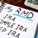 An Image Of A Notebook With My RMD, IRA, Simple IRA, And SEP IRA Written To Show The Important Retirement Plan RMD Rules Put On By Secure Money Advisors In Pittsburgh