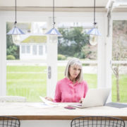 An Image Of A Women On Her Laptop About Required Minimum Distribution Mistake To Avoid Put On By Secure Money Advisors In Pittsburgh