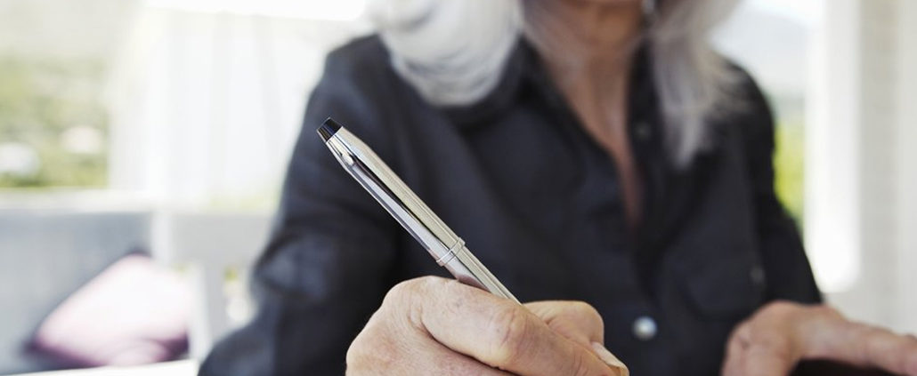 An Image Of A Women Writing In Her Notebook Preparing For Retirement Put On By Secure Money Advisors In Pittsburgh