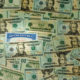 An Image Of A Social Security Card Surrounded By 20 Dollar Bills Put On By Secure Money Advisors In Pittsburgh For The Maximum Possible Social Security Benefit